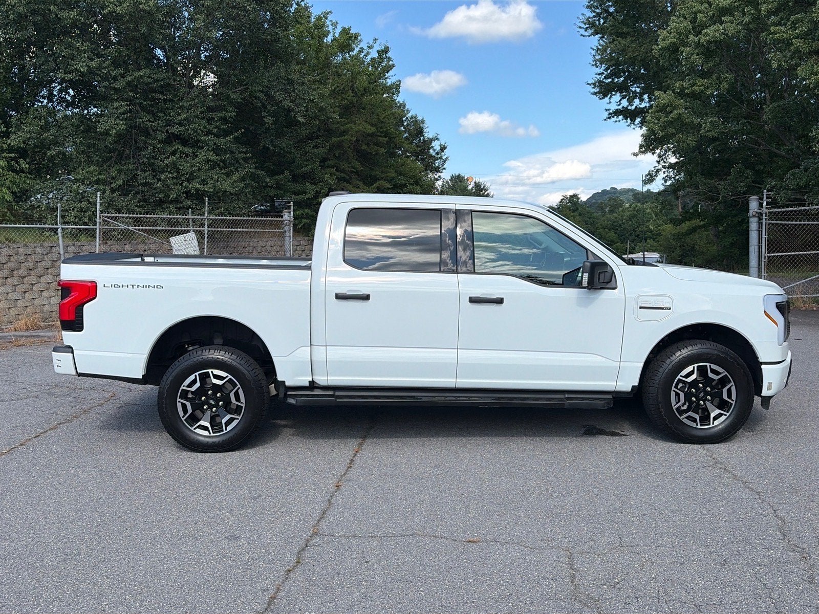 Used 2023 Ford F-150 Lightning XLT with VIN 1FTVW1EL1PWG55997 for sale in Canton, NC